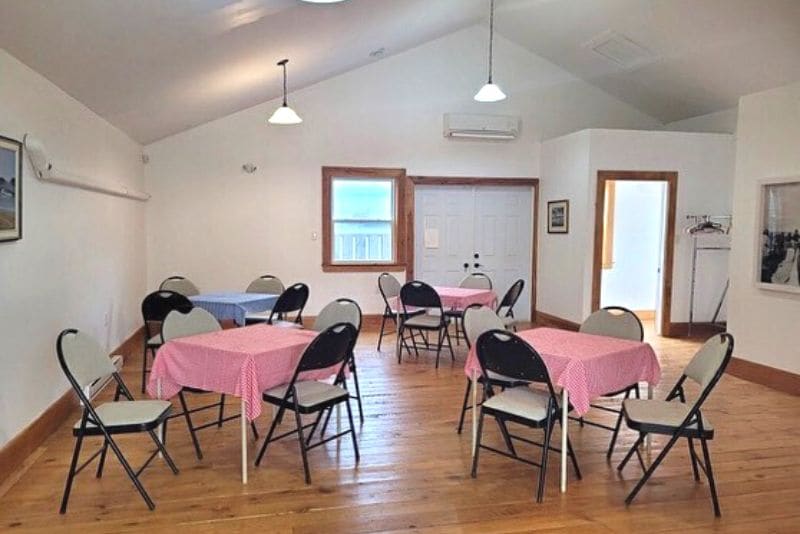 The community room on the museum upper level, set with tables